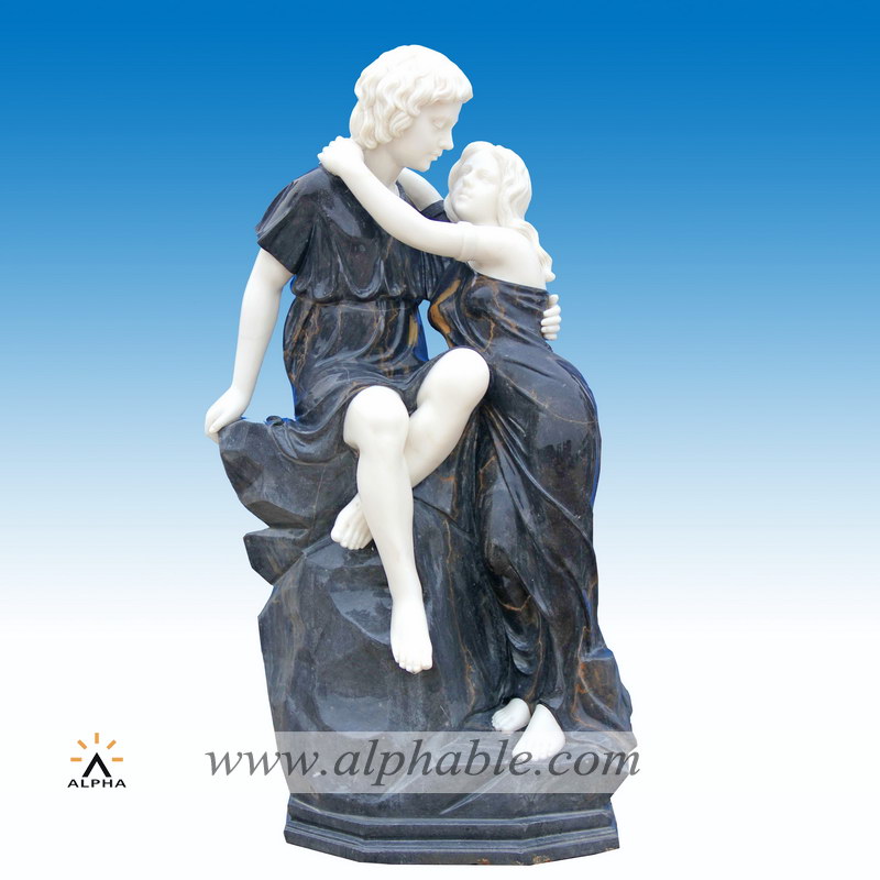 Marble boy and girl kissing statue